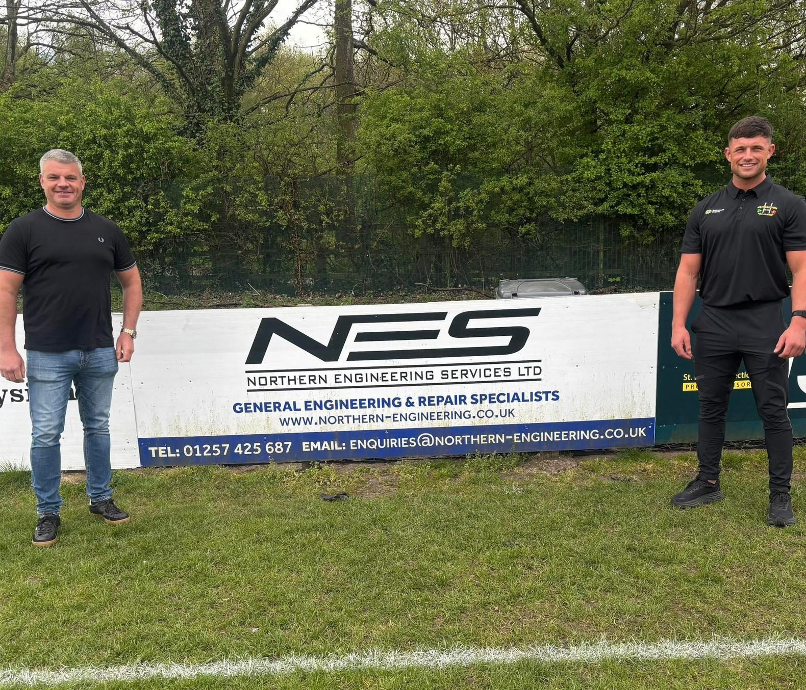 John and Brad stood either side of the Northern Engineering Services pitch-side banner at the ground