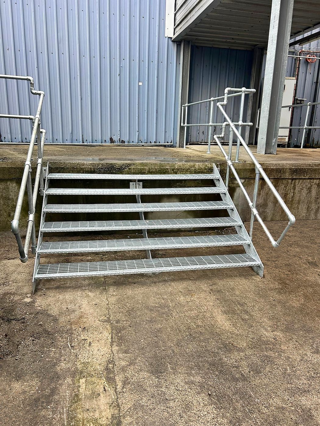 Steel access steps with handrails, fitted on site